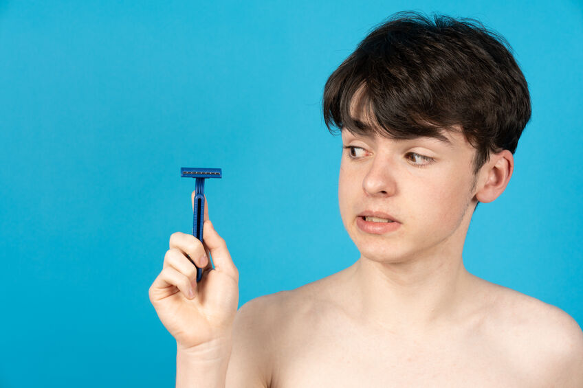teenager-boy-holding-razor-1773684621.jpg